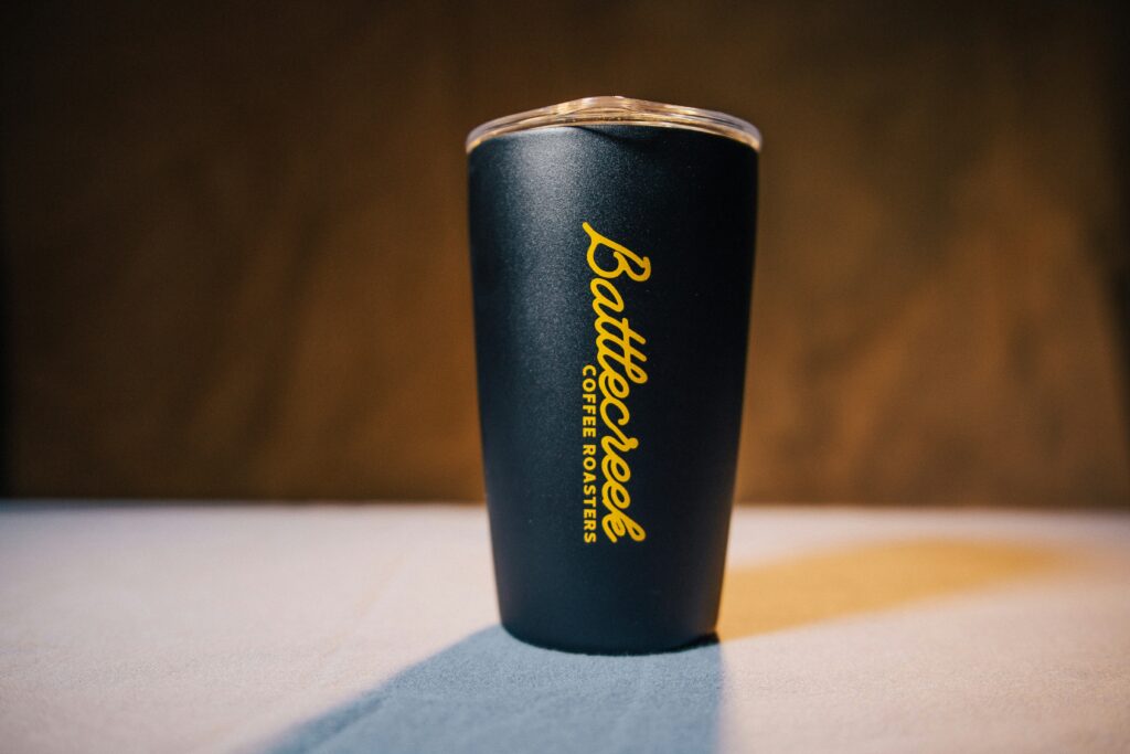 A black drink tumbler representing customized promotional products.
