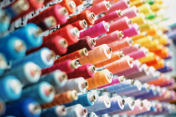 Spools of thread depicting embroidery color trends.