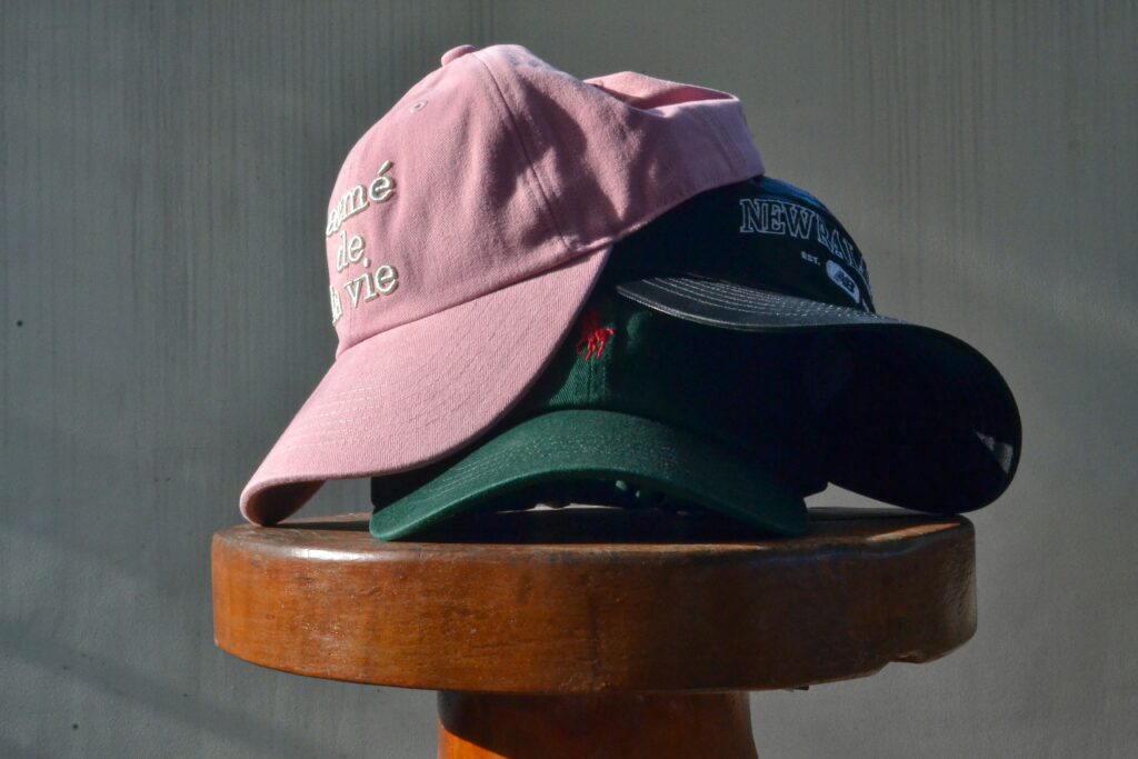 Embroidered custom branding on a collection of ball caps.